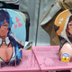 At Anime NYC a vendor sold oppai mouse pads of Kaeya and Zhongli from Genshin Impact.